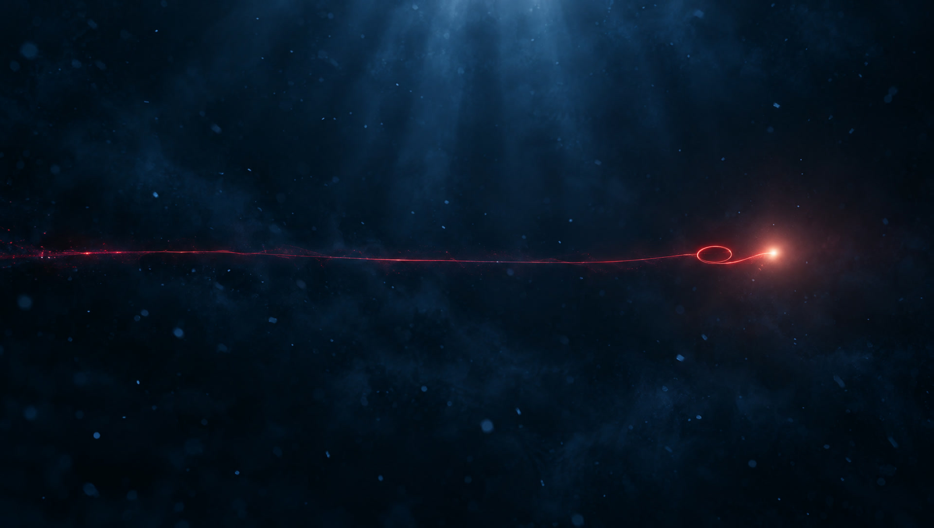 A red thread of light streaking through darkness and arriving at a warm glowing point.